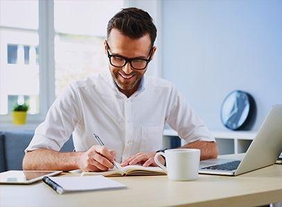 Person writing in notebook