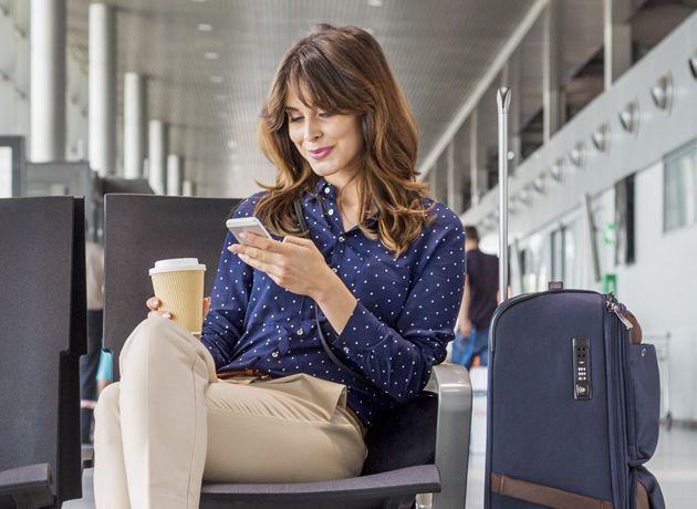 Person at airport on phone