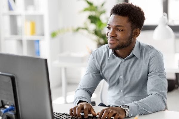 happy person using computer