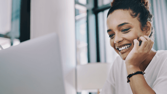 Person happy looking at computer