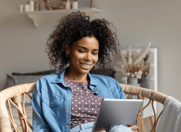 person with tablet on chair